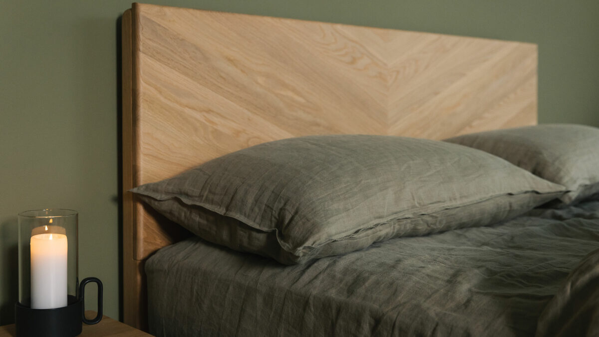 olive green linen bedding shown on a bed