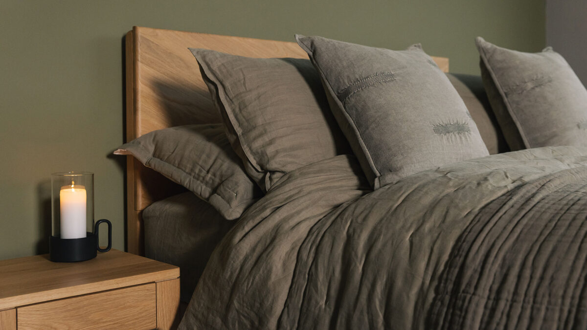 olive green linen bedding shown with matching quilted bedspread set