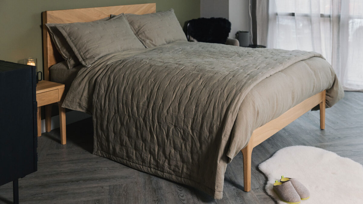 Olive green bedding and quilted bedspread sets shown on an Oak Highbury bed