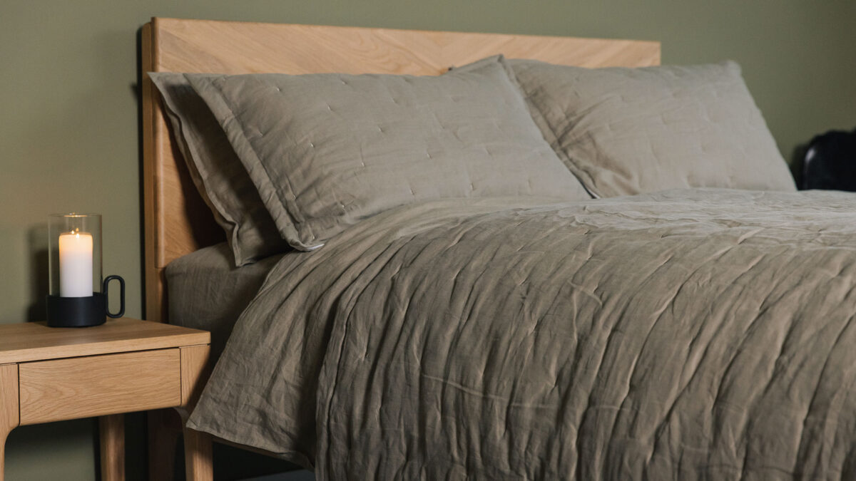 Olive green linen bedding and quilted bedspread sets shown on an Oak Highbury bed