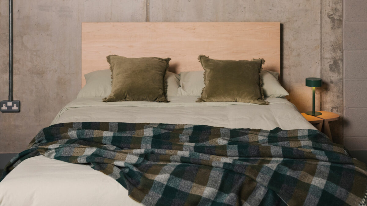olive velvet cishions with stonewash bedding and dark green and olive throw
