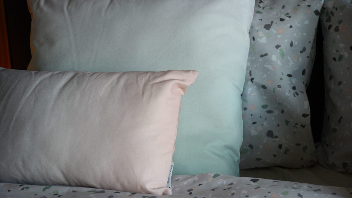 Pastel coloured cushions in ombre tones, pink or green