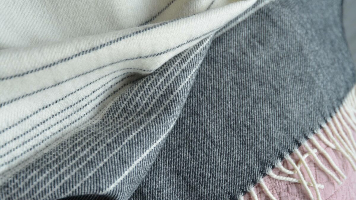 ombre stripe throw in ivory and dark grey