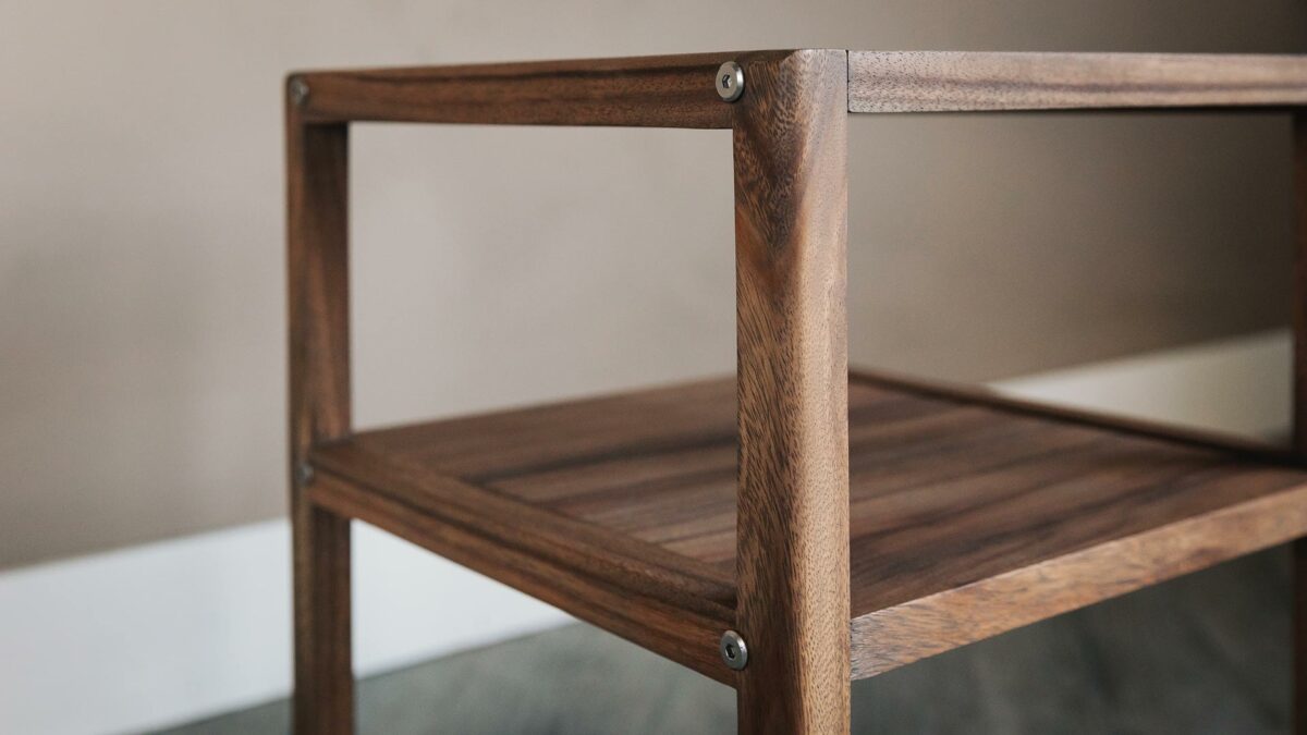 wooden bedside table with open shelf in a walnut like wood