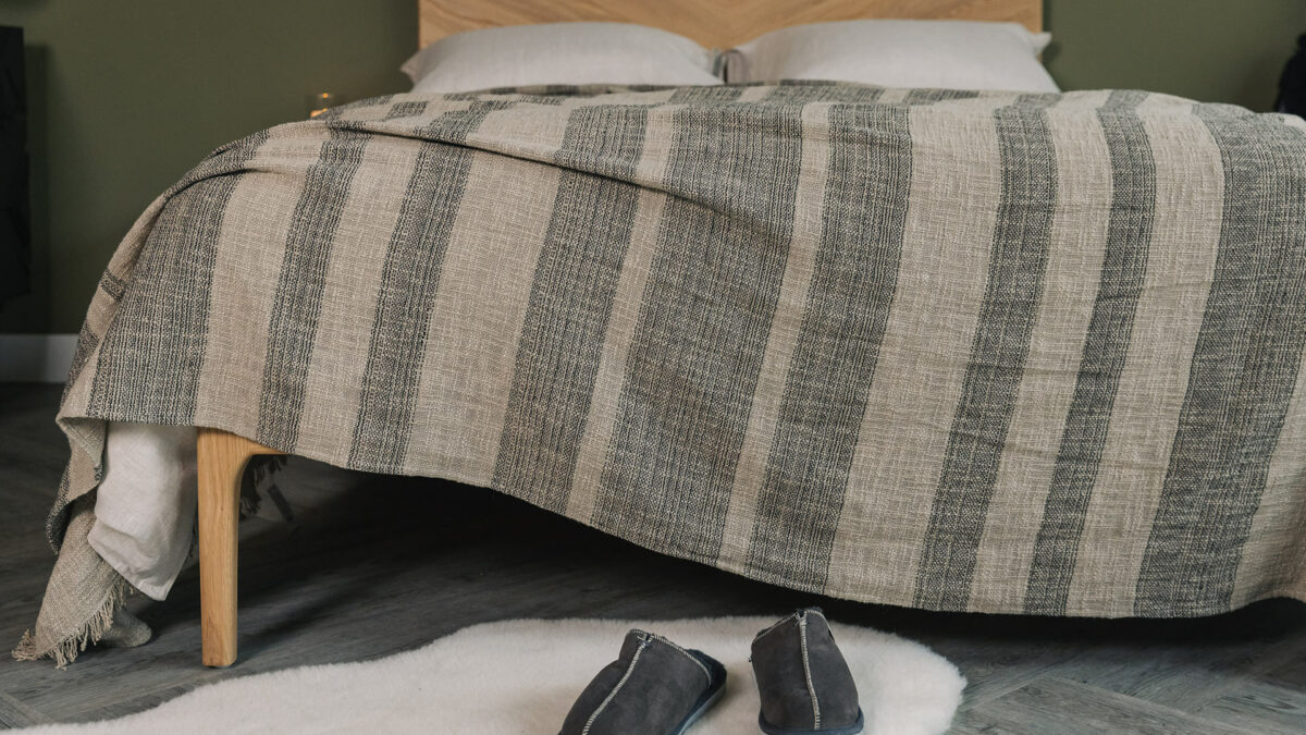 luxurious textured weave bedspread with stripes of taupe and black threads