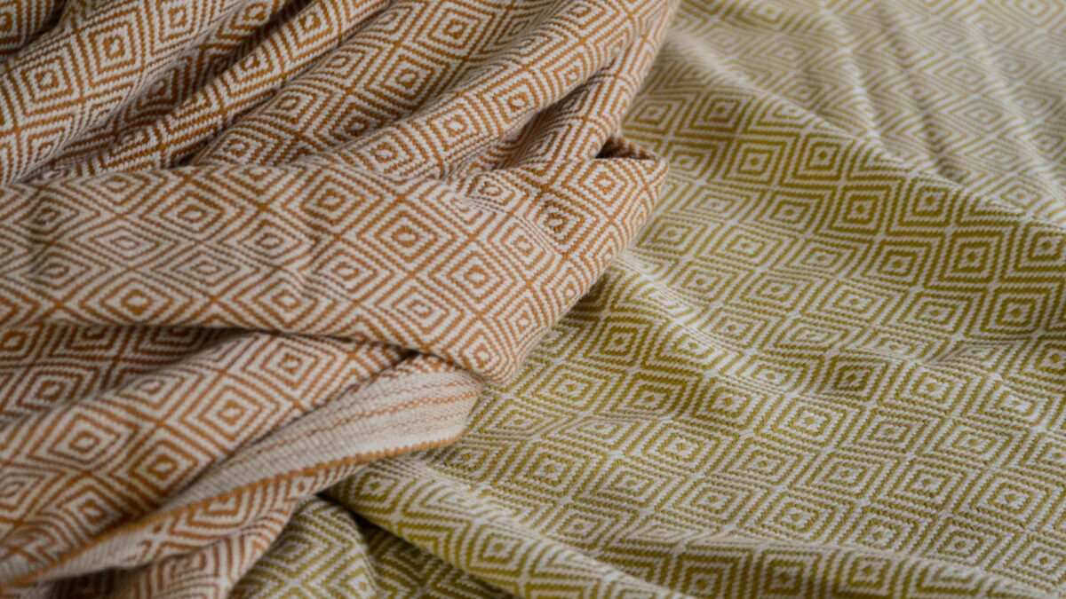 woven cotton blankets in tan or chartreuse colour