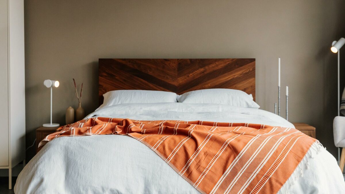 oiled walnut hathersage chevron headboard white linen and orange turkish throw