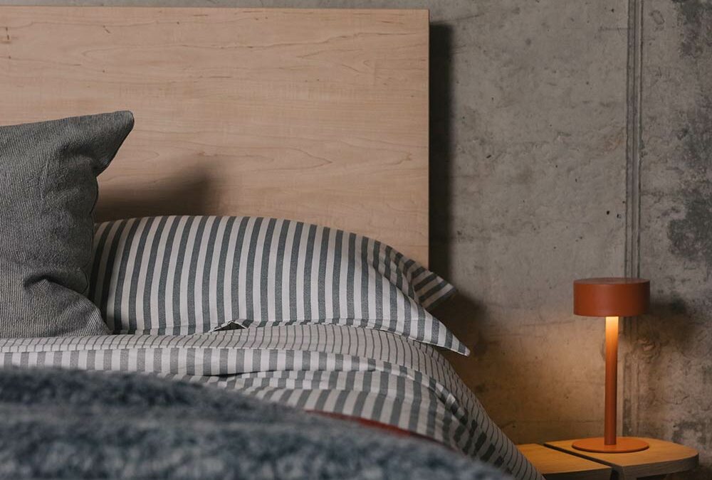 orange table lamp with maple bamford bed portrait