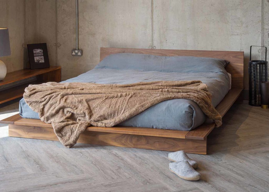 Modern low platform-style solid wood bed The Oregon, in rich luxurious Walnut wood