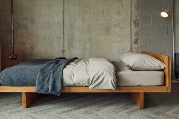 Side view of our Kyoto bed in Oak. Available to order in a choice of solid wood and a range of sizes.
