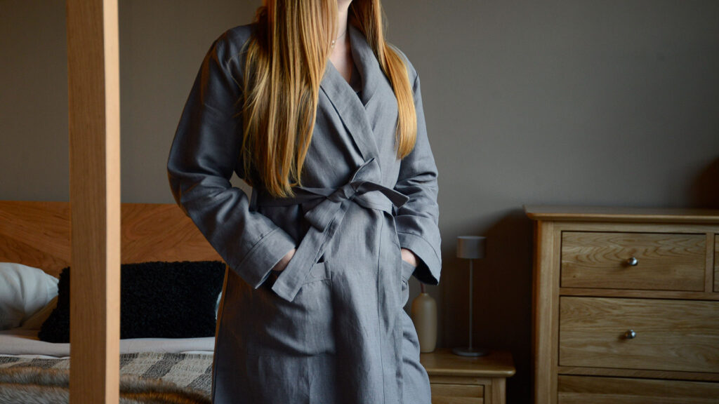 organic charcoal linen robe with hands in pockets
