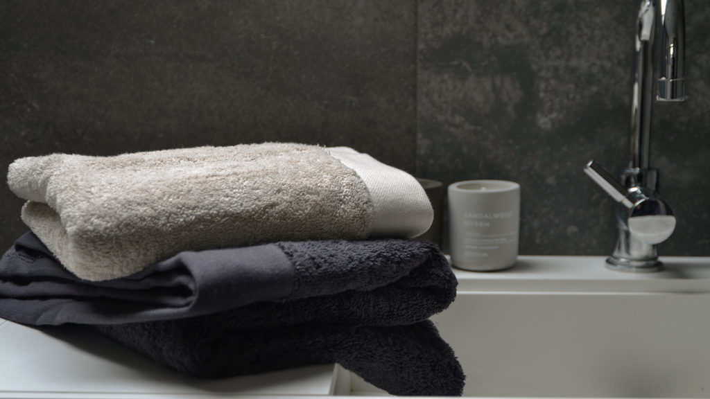 eco friendly GOTS certified organic cotton towels in dark grey or pale clay