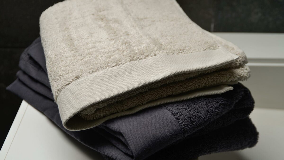 organic cotton bathroom towels in dark grey or pale clay