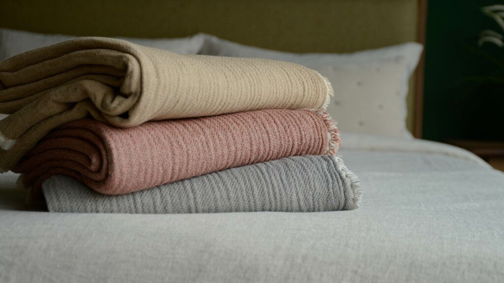 organic cotton reversible throws in 3 colour options