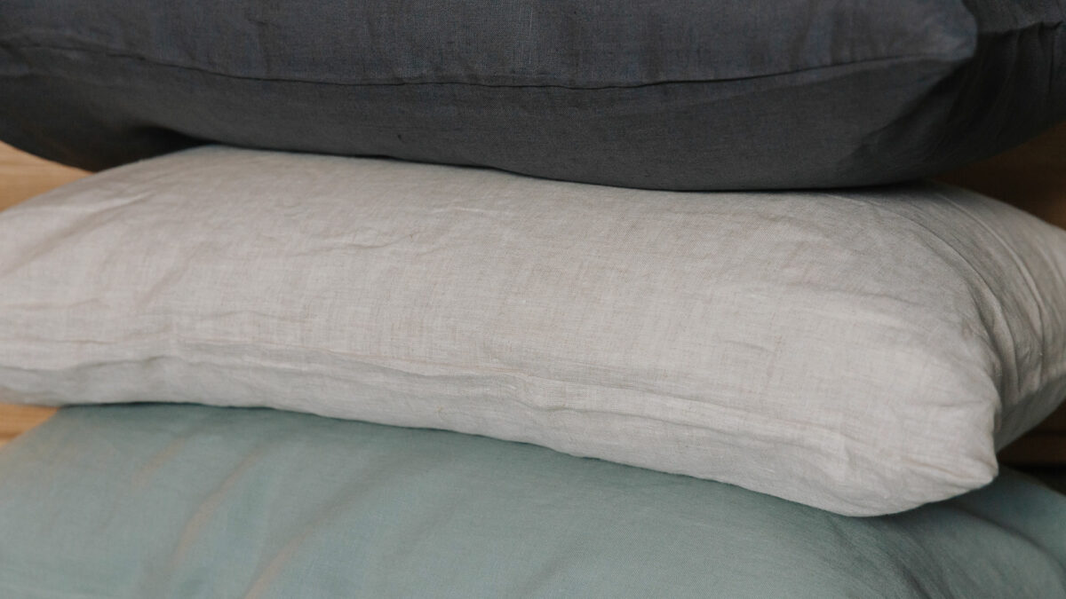 organic linen bedding pillow stack showing the 3 colour options