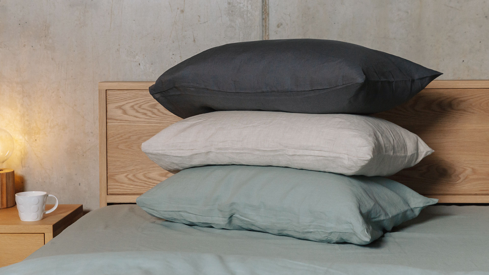 organic linen bedding - a stack of pillows showing the 3 colour options