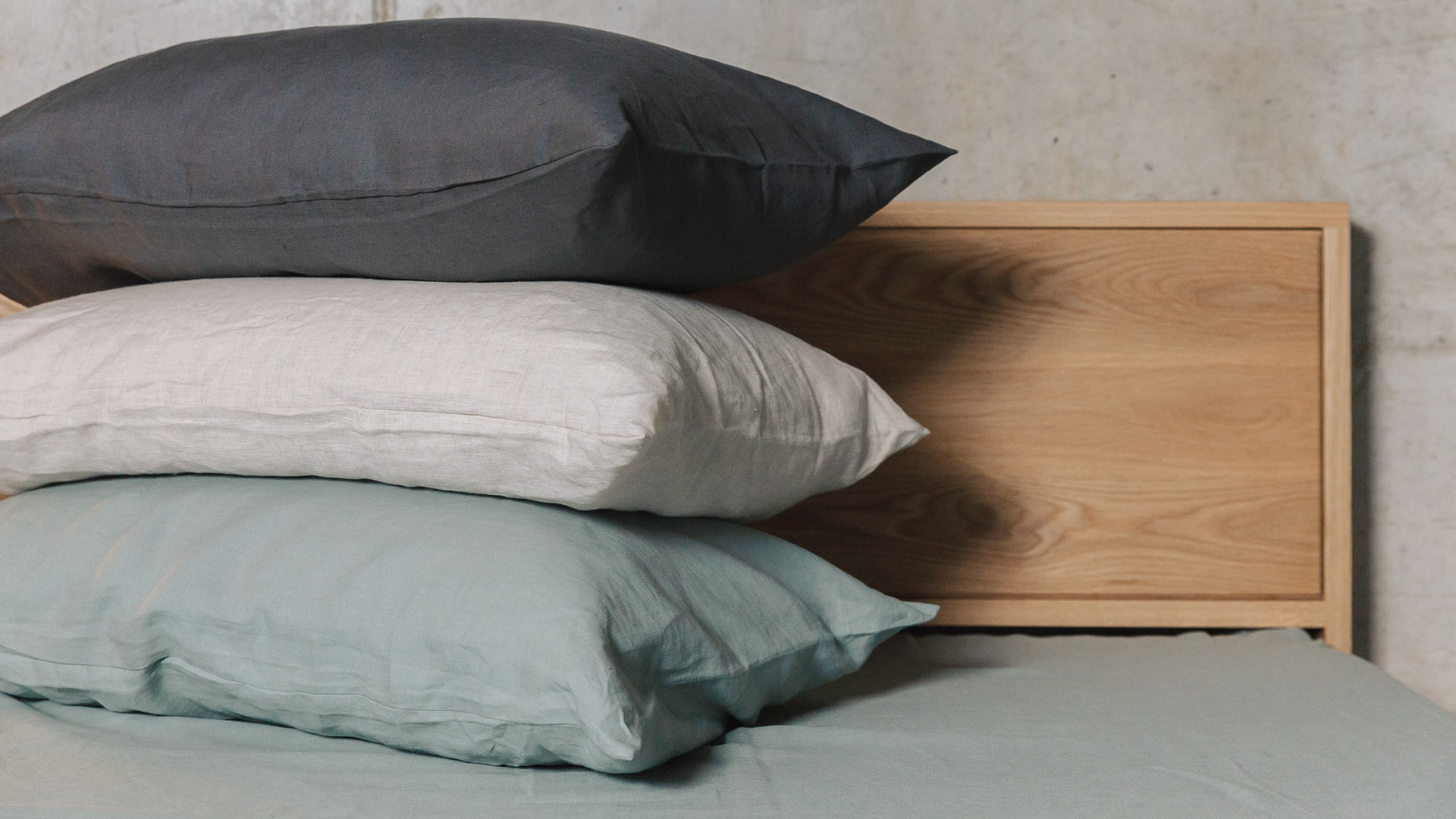 organic linen bedding pillow stack showing the 3 colour options