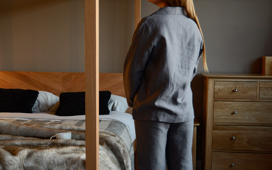organic linen pyjamas in charcoal grey shown on a model and from the back