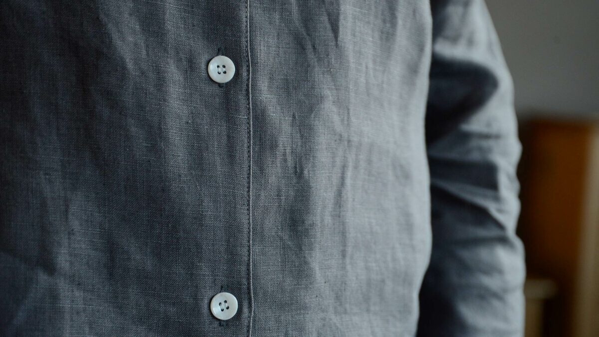 organic linen pyjamas in charcoal grey shown in close up