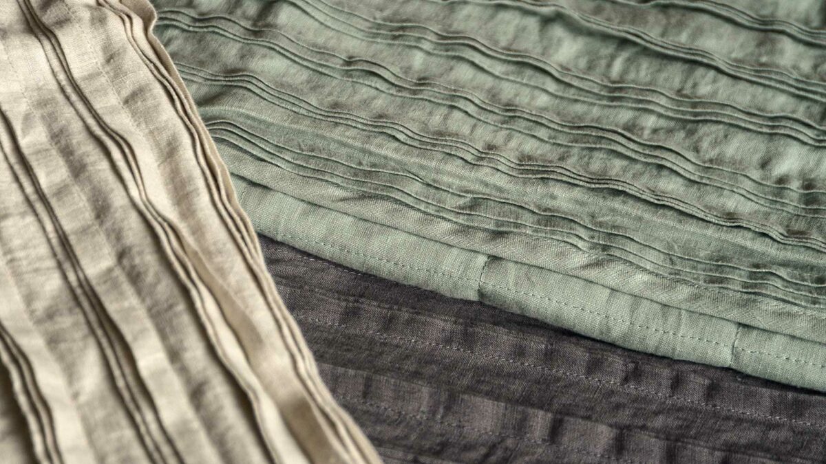 linen ruffle edge throws in 3 colours, Sage, Grey, and Ivory shown close up