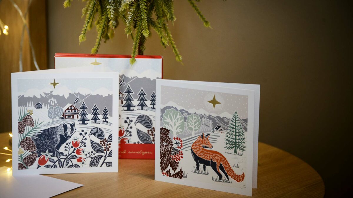 pack of woodcut look xmas cards fox and badger