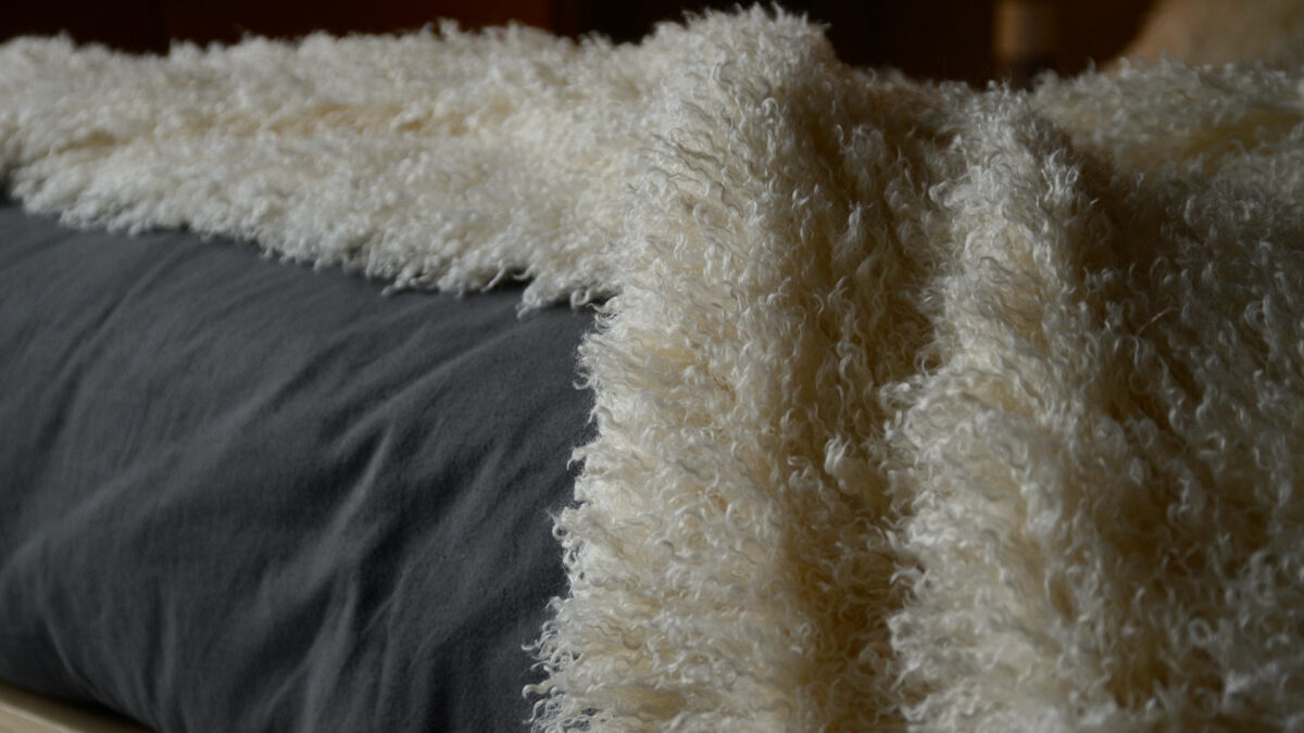 pale cream faux afghan throw detail