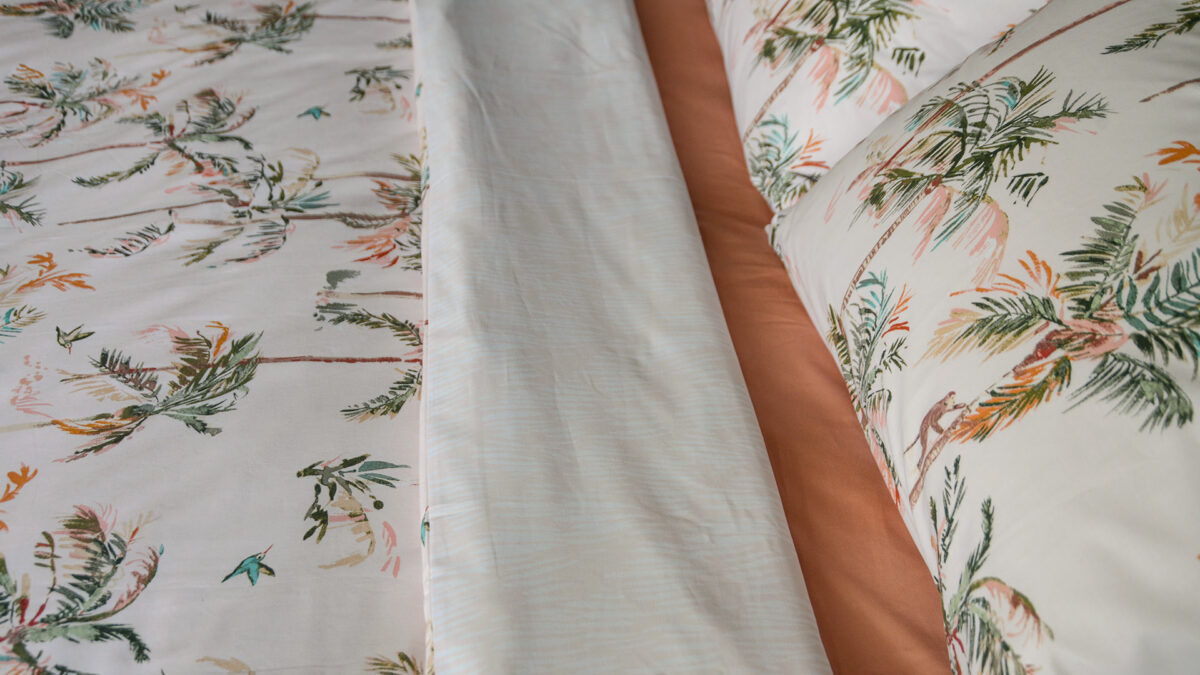 reversible blush pink duvet cover set with tropical palms print a closer view