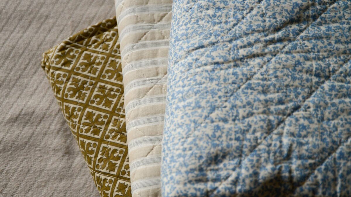 patterened quilts in gold cream or blue