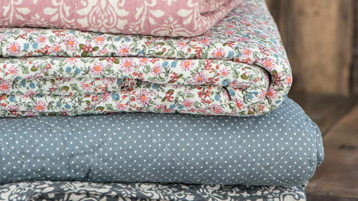patterned-blue-grey-and-pink-quilts