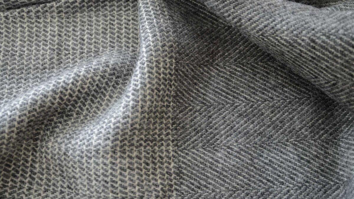 patterned pure wool throw in grey and ivory