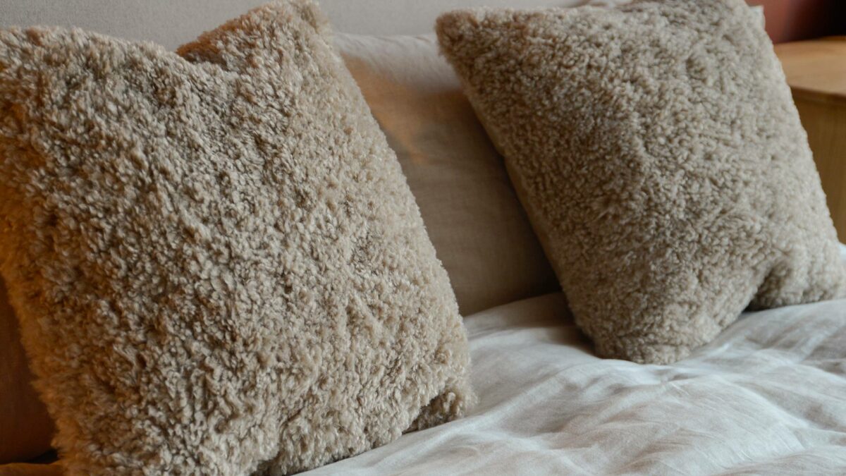 pebble colour faux fur cushion
