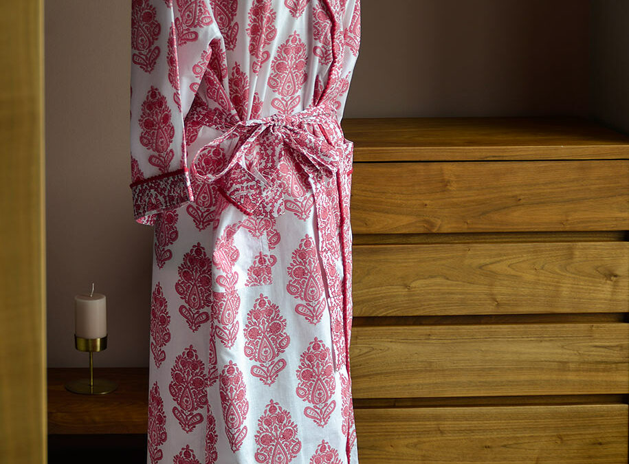 block print design cotton robe in pink and white with pom-pom trim