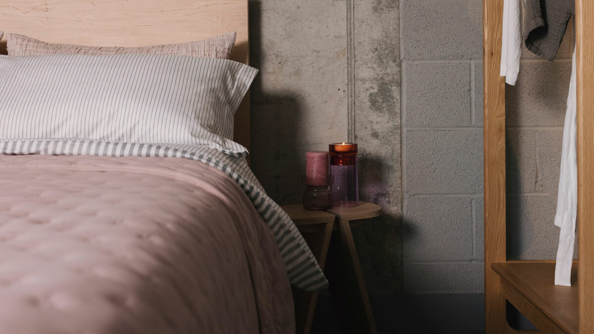 pink glass candle holders with blush bedding