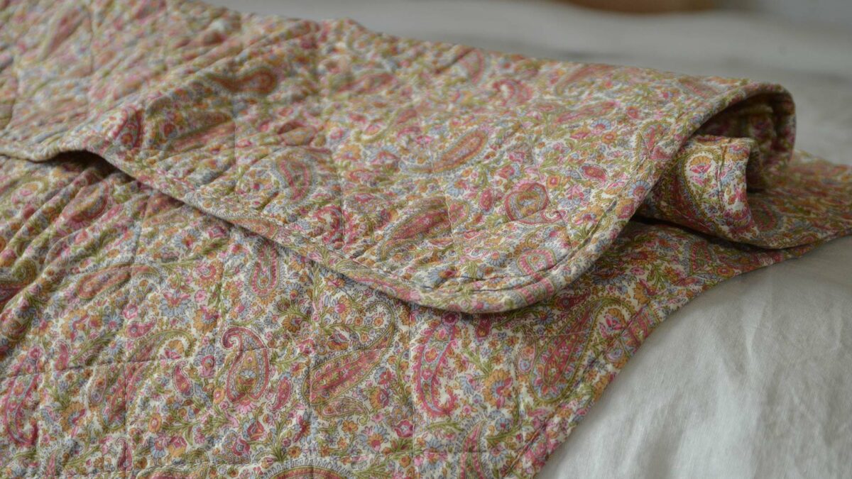 pink paisley printed quilted throw