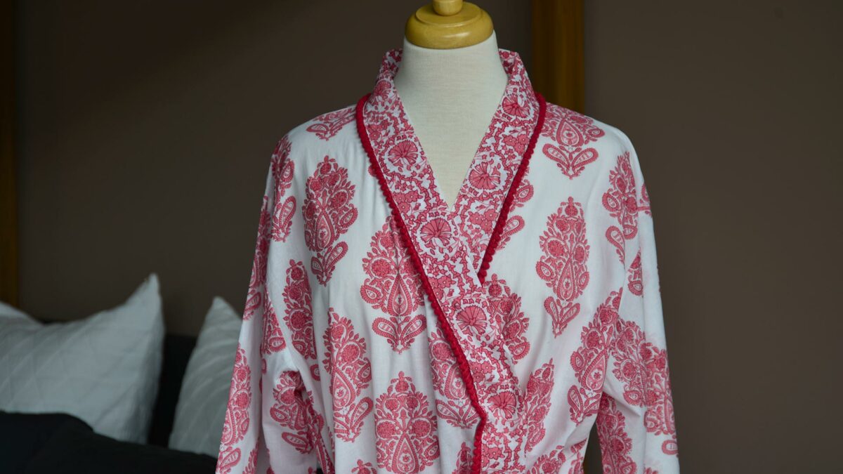 block print pattern light cotton dressing gown in pink and white, the neckline