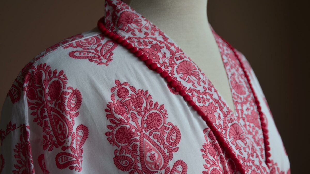 a close up of the block print pattern to the pink and white light cotton robe