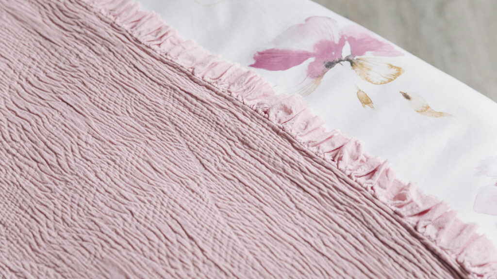 ruffle edged textured bedspread in rose pink