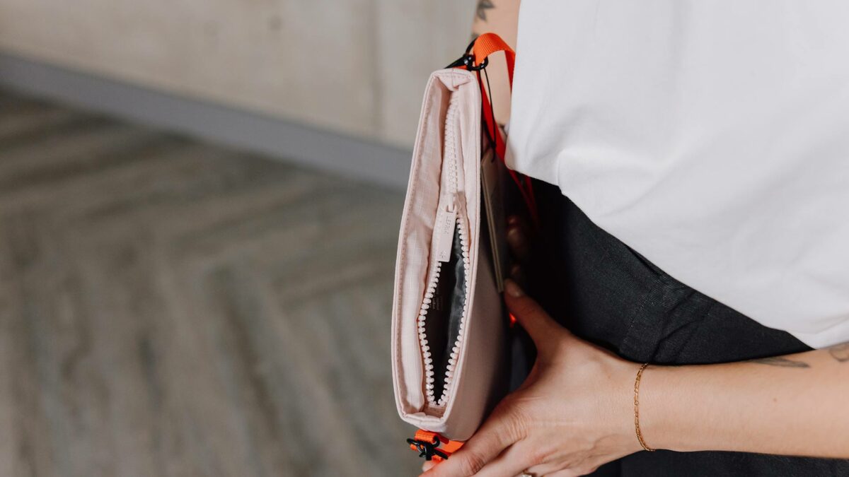 pink shoulder bag with orange strap