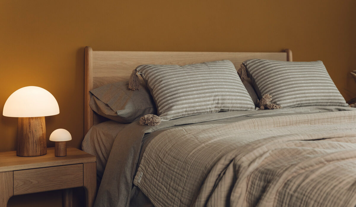 The Camden mid century style bed with matching Camden bedside table made in solid oak wood