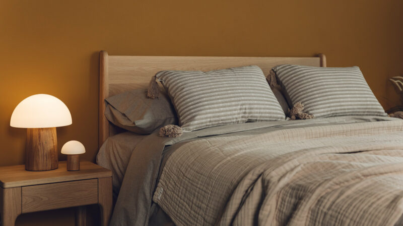 The Camden mid century style bed with matching Camden bedside table made in solid oak wood