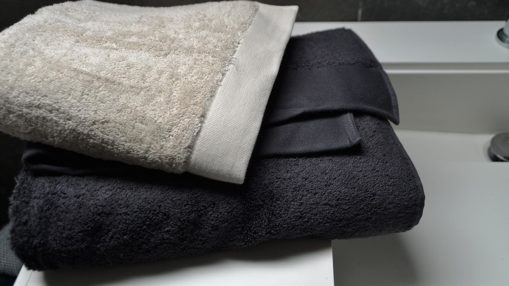 organic cotton towels in dark grey or pale clay