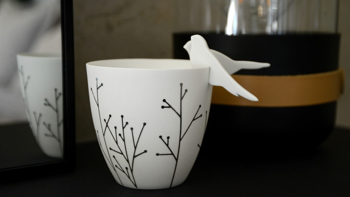 porcelain t light holder with silver decoration