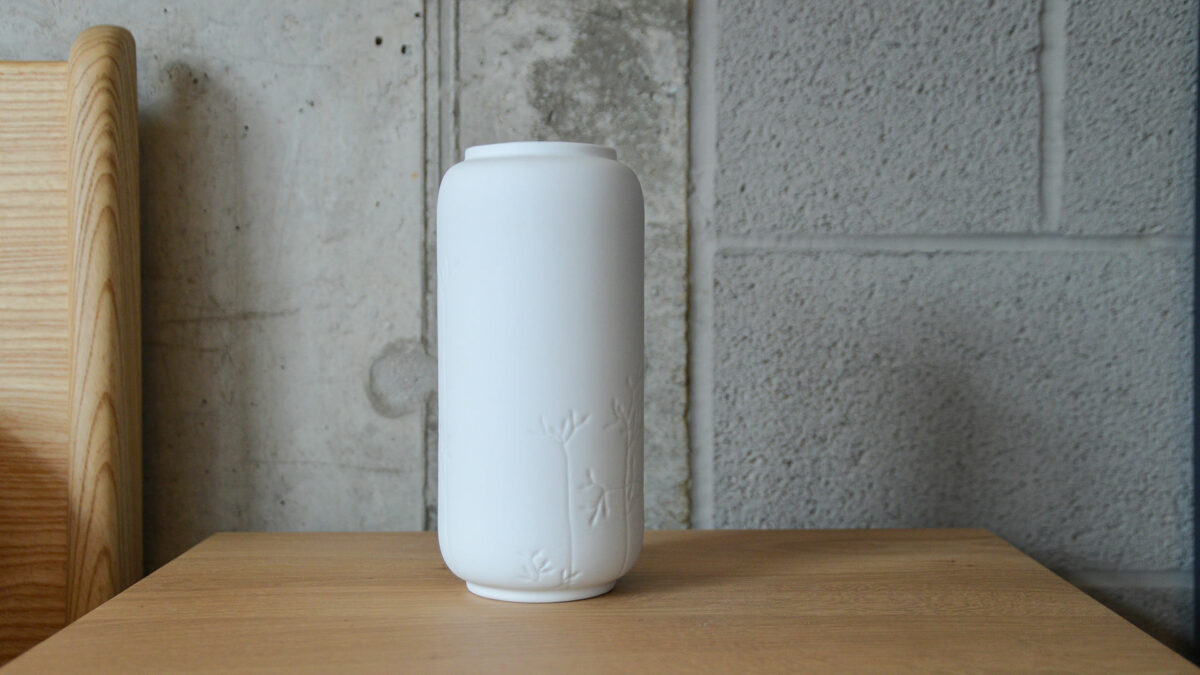 porcelain vase with floral pattern and gold detail back