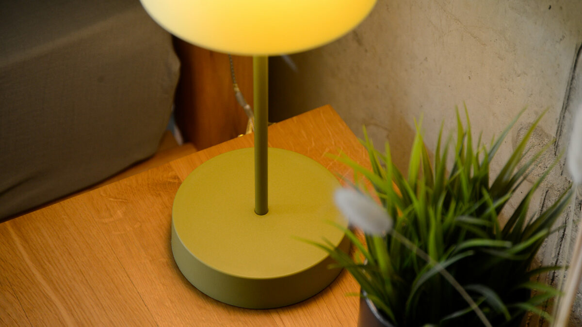 portable green table lamp base close up