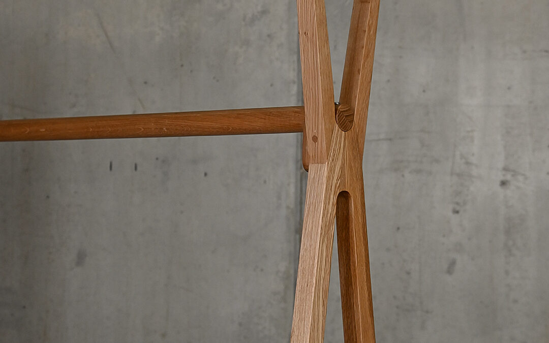 Portrait image of the Freestanding Solid Oak Clothes Rail, showing the shape of the legs/sides of the rail and the detail of the cross beams.