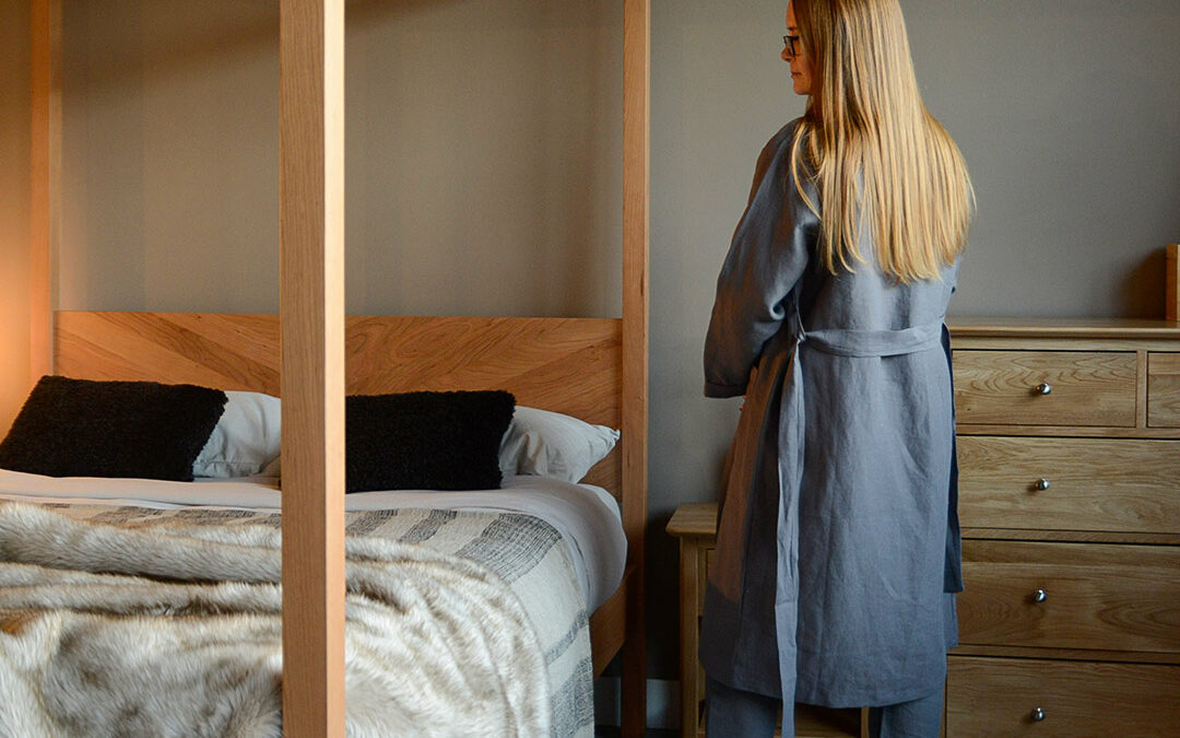 organic linen dressing gown in charcoal grey shown on a model and from the back