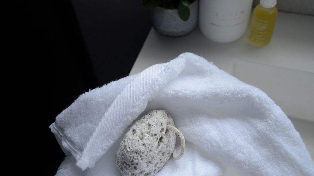 Sevin pumice stone shown with softest white towel