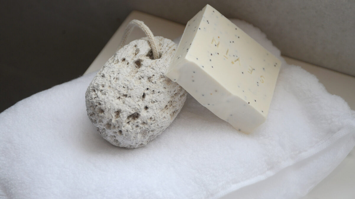 Sevin natural soap bar shown with pumice and softest white hand towel