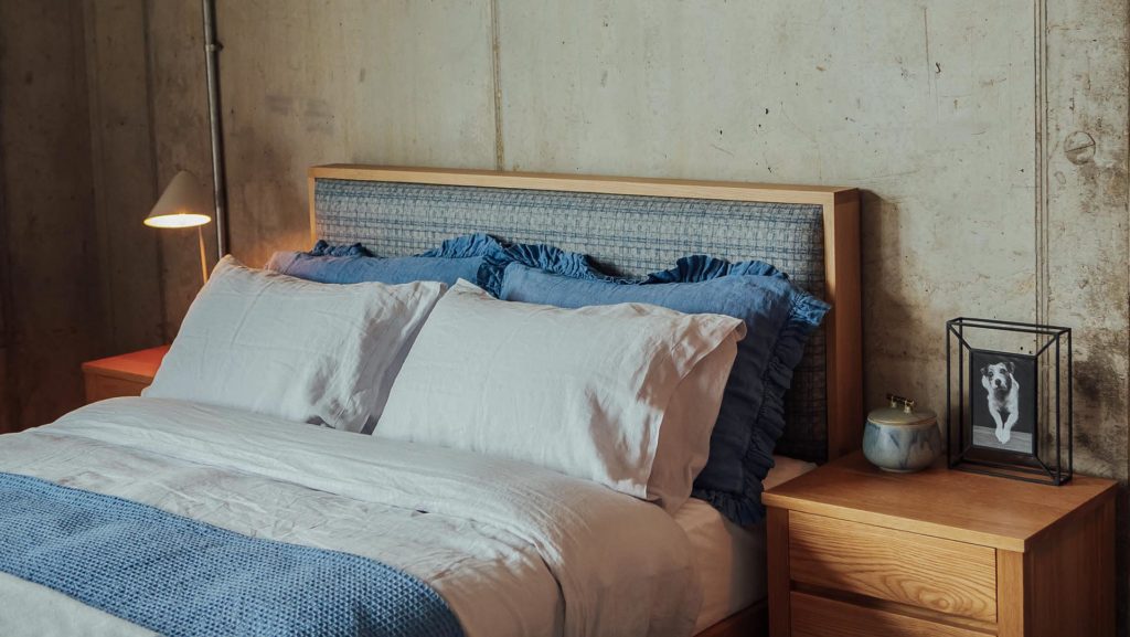 patterned wool padded headboard on our wooden Shetland bed