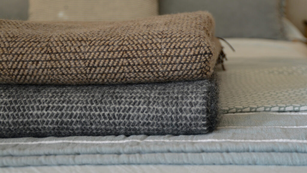 cosy pure wool throws available in Brown and grey